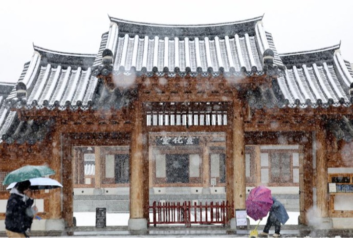 Snow on traditional tiled roofs