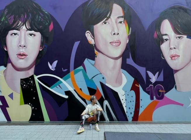 Street artist behind BTS mural discusses his creative evolution